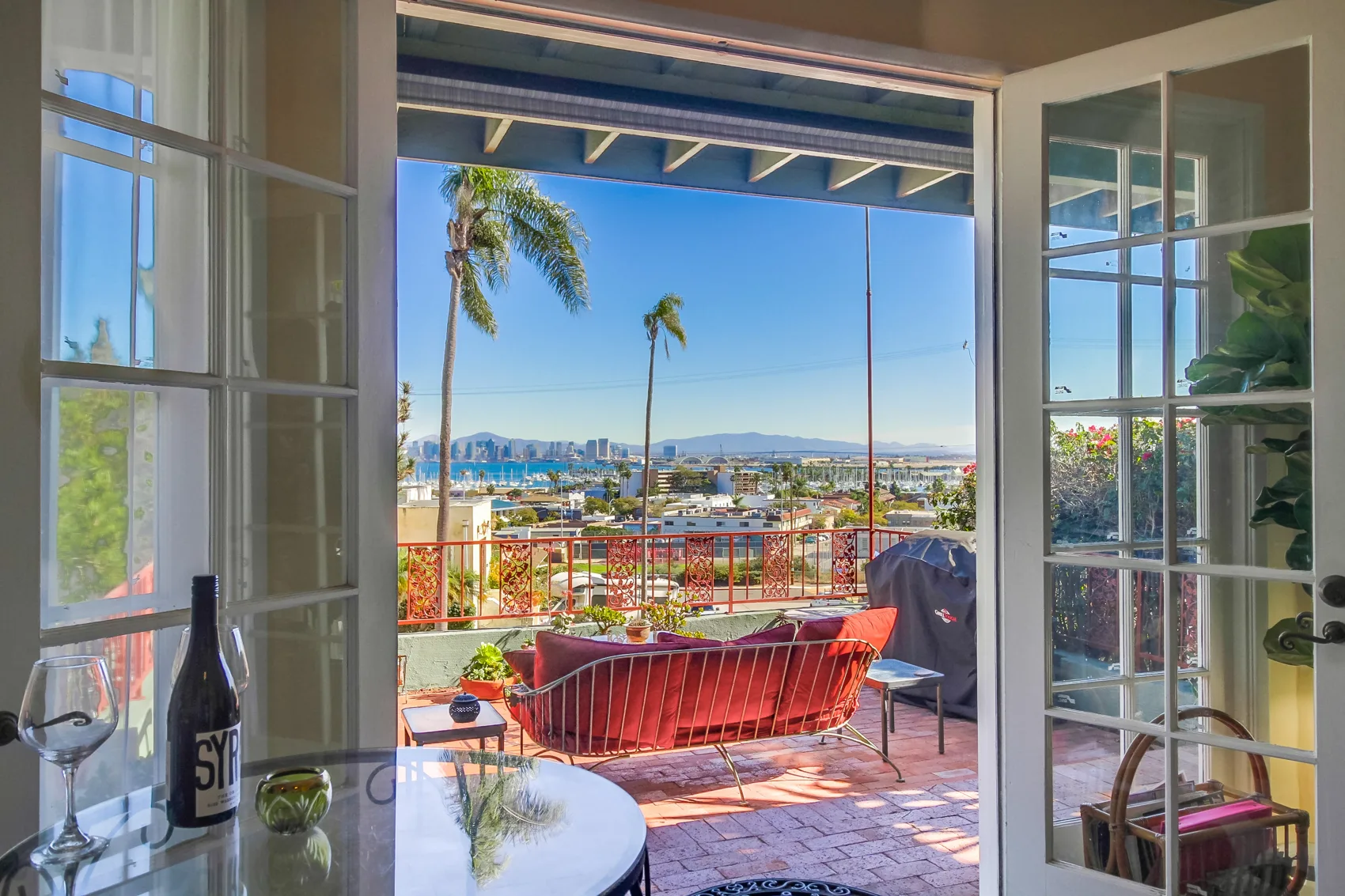 Bright bay view through open French doors