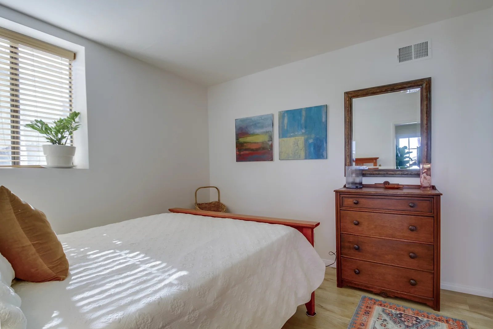 A very comfortable queen bed and drawers for your clothes — ditch the suitcases!