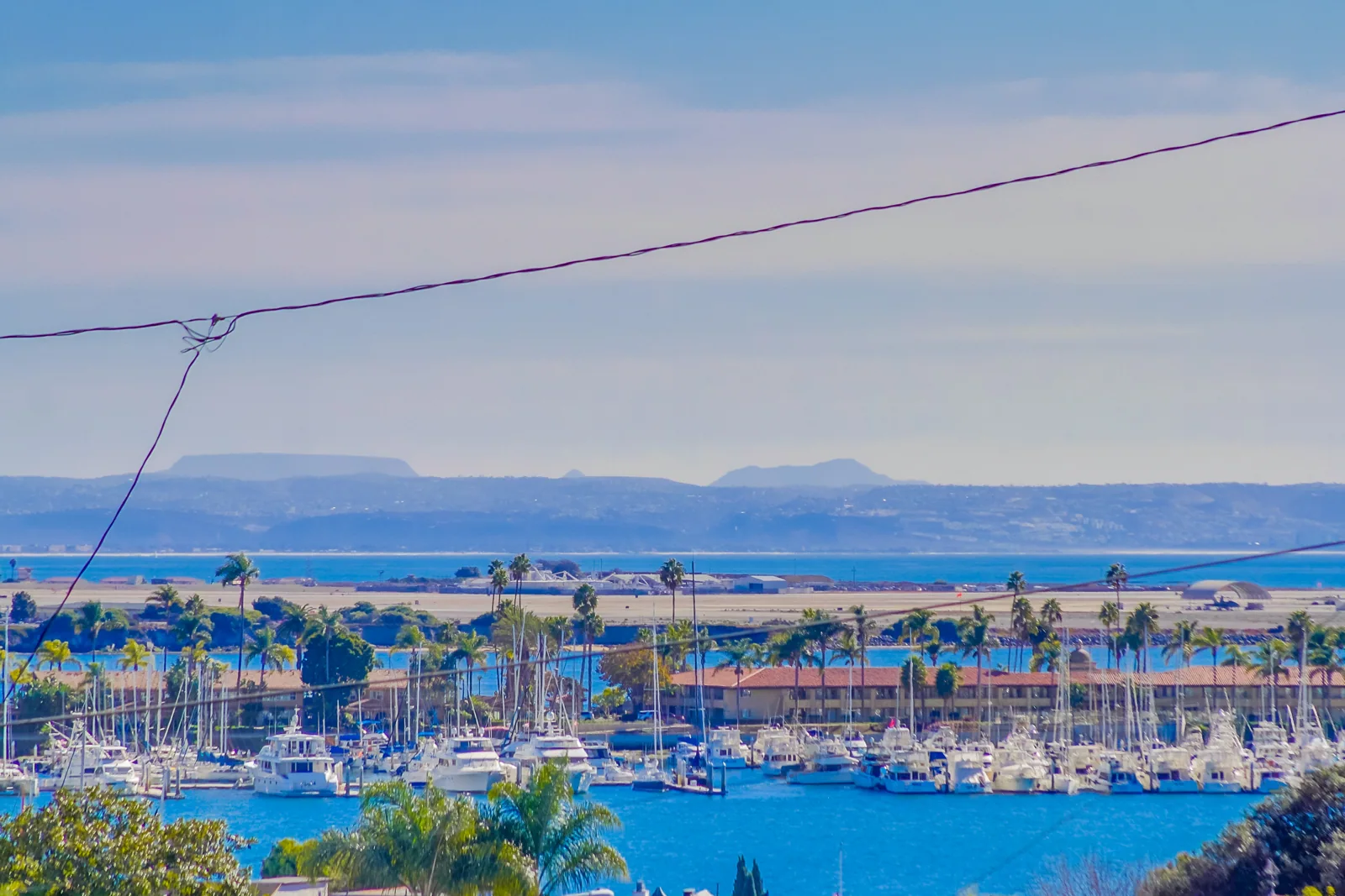 Looking toward the bay, marina, and distant mountains in Mexico.